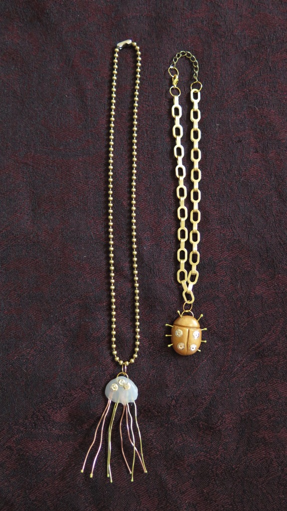 Jellyfish and beetle necklaces